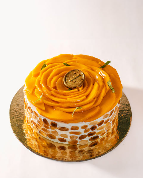 Almond Dacquoise, Mango Compote & Light Cream Cake